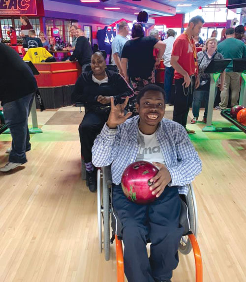 Man with wheelchair bowling